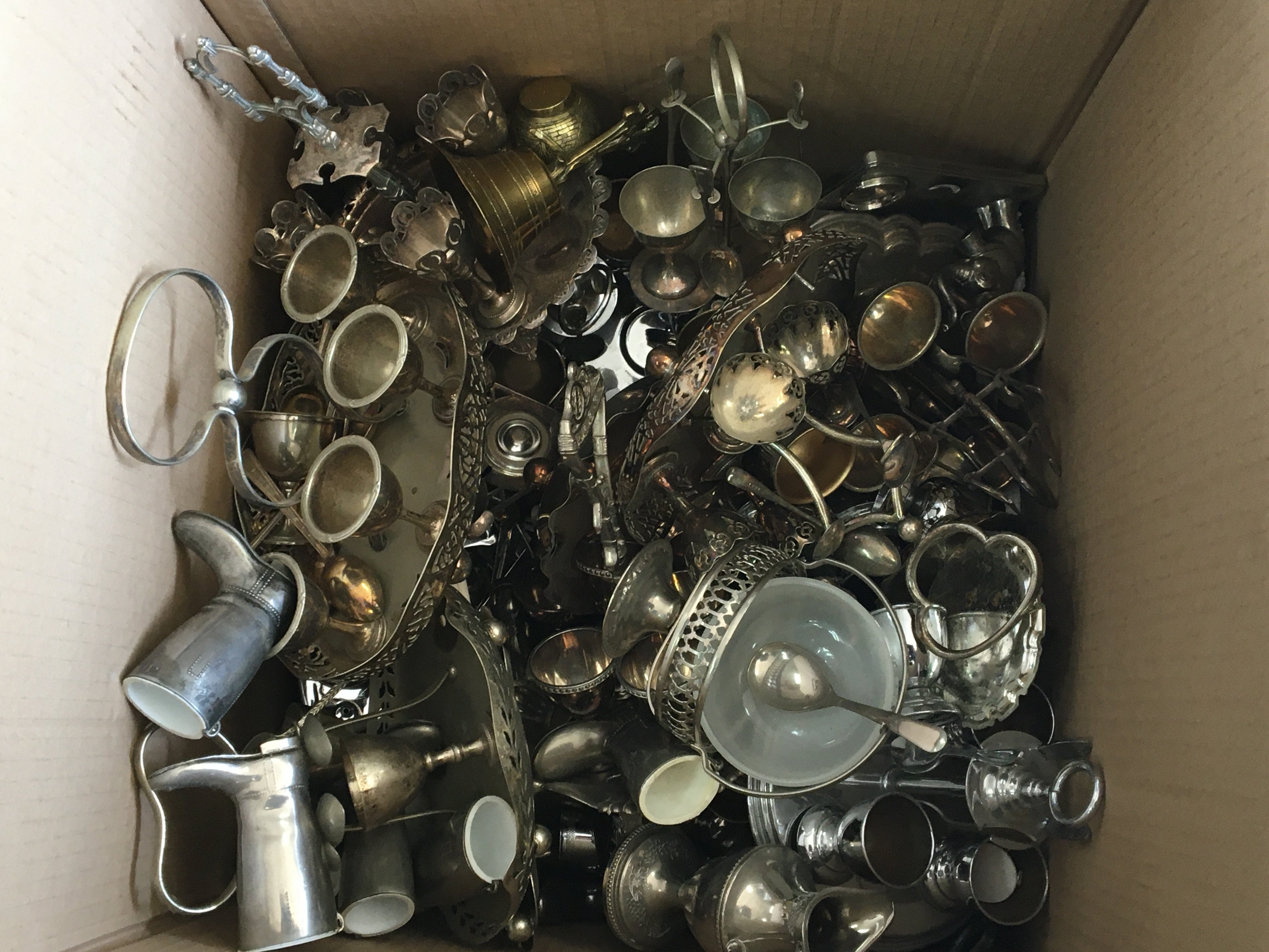 A box containing a large quantity of silver plated