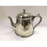 A heavy silver plated teapot engraved with a Weste