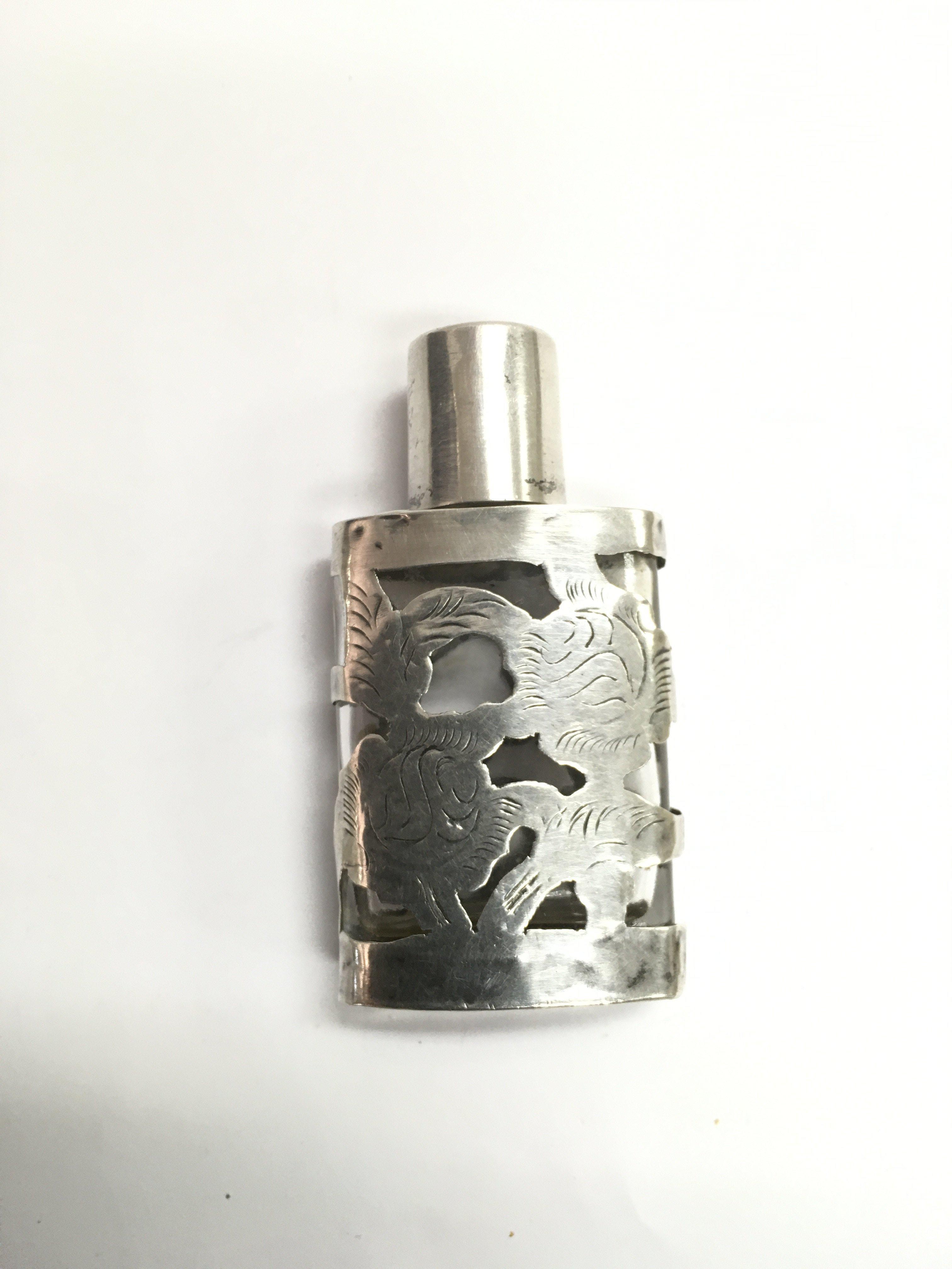 A small silver overlaid glass scent bottle impress