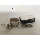 A Chinese silver spoon napkin ring and match case
