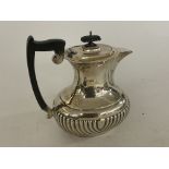 A hallmarked silver coffee pot. Approx 690g, Sheff