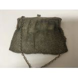 A silver chain mail purse with London hallmarks