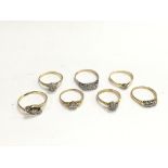 A collection of seven 18ct gold diamond rings, app