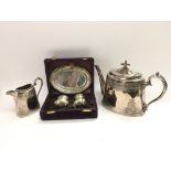 A cased silver plated three piece cruet set togeth