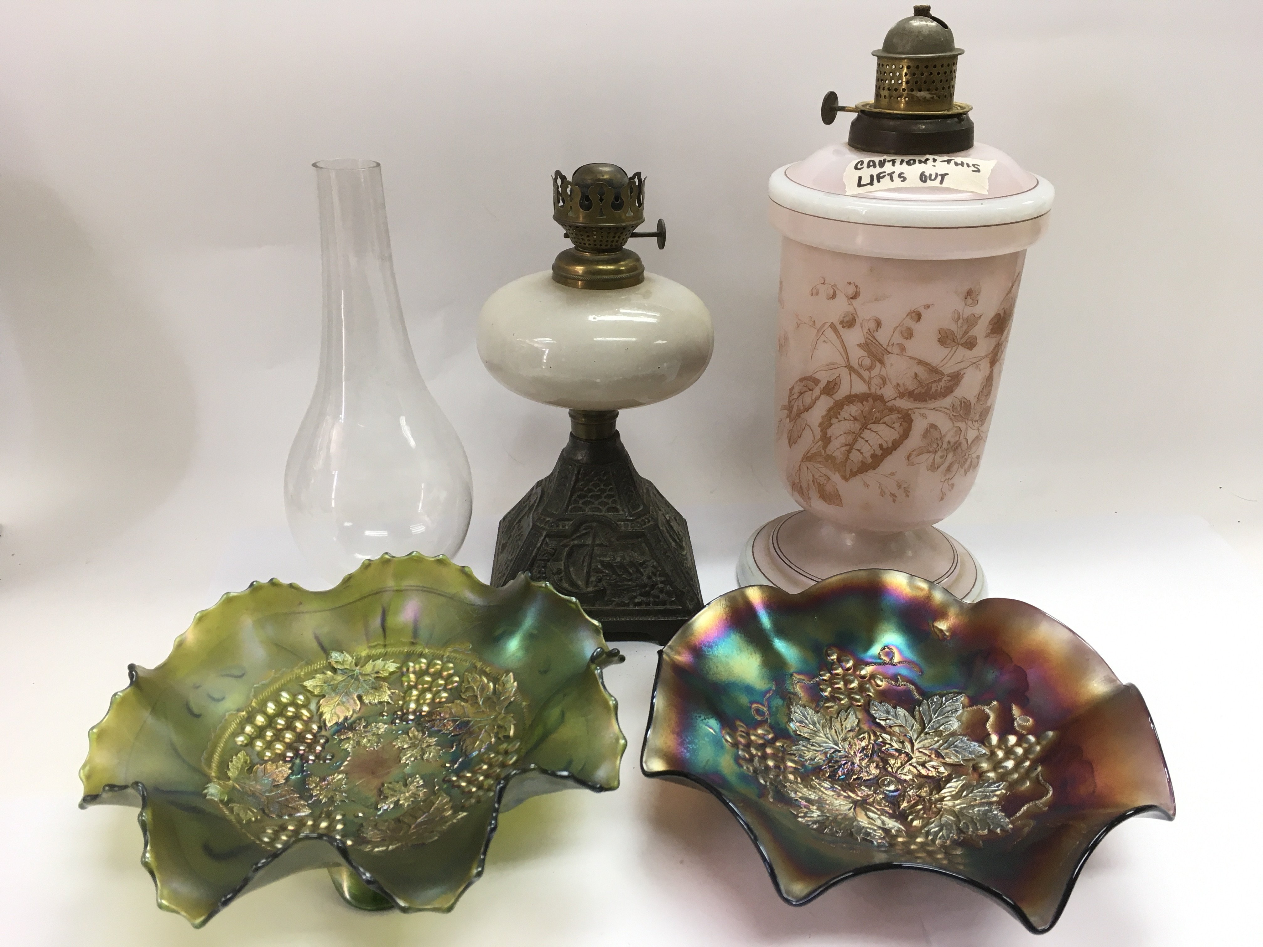 Two Victorian oil lamps and two carnival glass dishes (4).