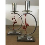 A pair of Art Deco chrome lamps supported with sty