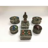 Six metal trinket boxes set with stones and millef