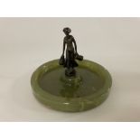 A small figure of a bronze mounted on an onyx asht