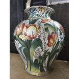 A large vase decorated with Tulips. 35cm in height