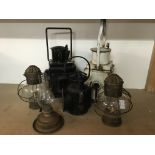 Five oil lamps including two railway lamps