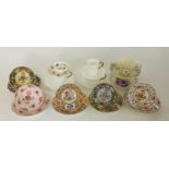 A selection of mixed cabinet cups and saucers.