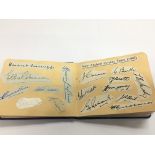 An autograph booklet containing various cricketers