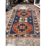 A hand woven eastern wool rug with geometric design, 212 x 130cm