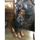 A large porcelain figure of a doberman pinscher, a