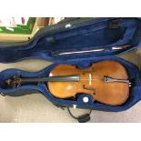 A cased cello and bow, label inside soundhole read