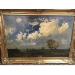 A gilt framed oil on canvas depicting countryside