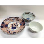 An Oriental scalloped dish with central image of f