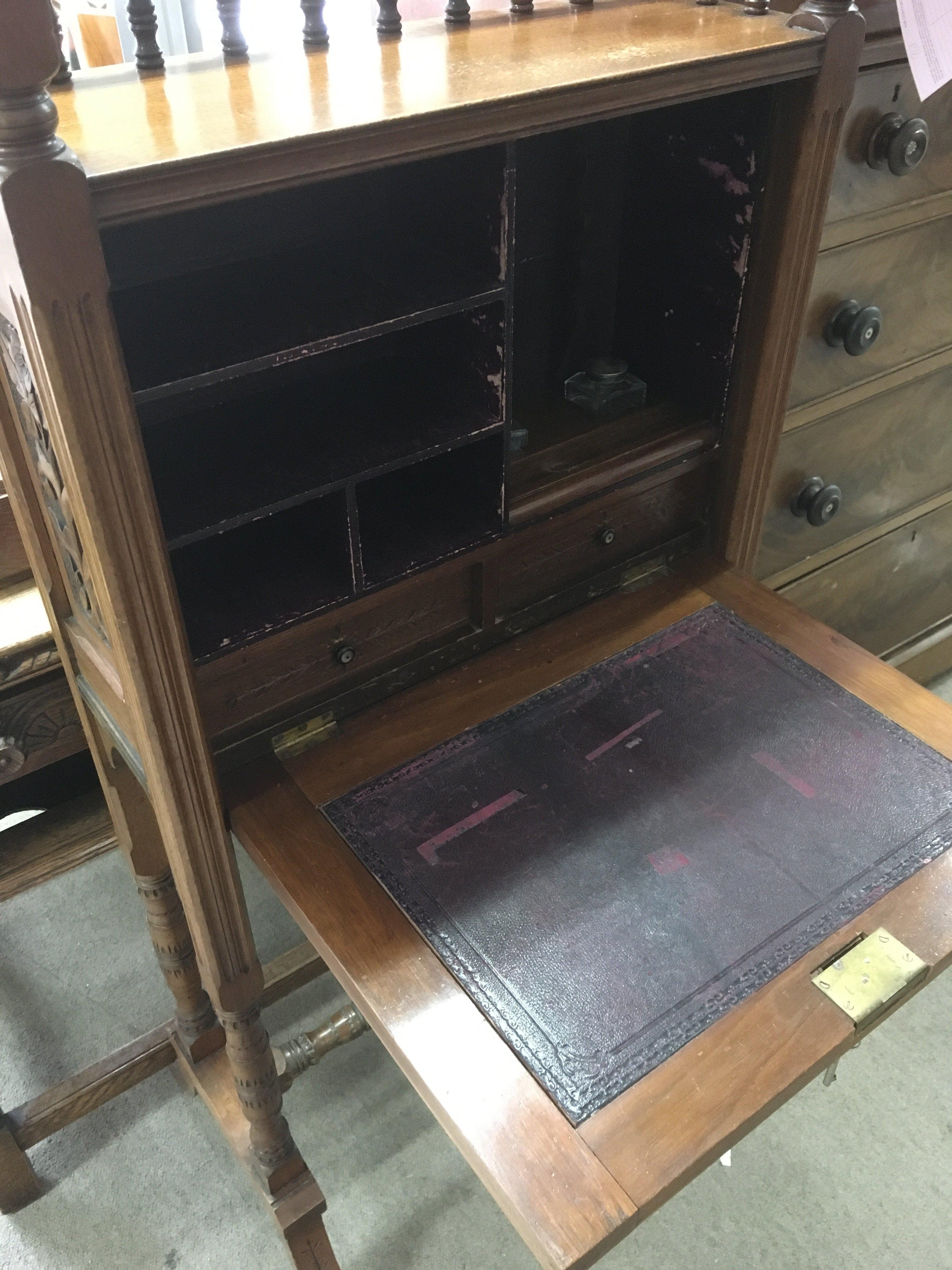 An oak bureau with heavily carved floral panels, g - Image 2 of 3