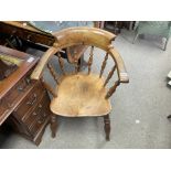 An Victorian oak spindle back captains chair.