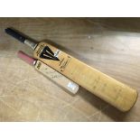 Two signed cricket bats with various signatures