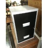 A metal two drawer filing cabinet, approx 40cm x 40cm x 66cm.