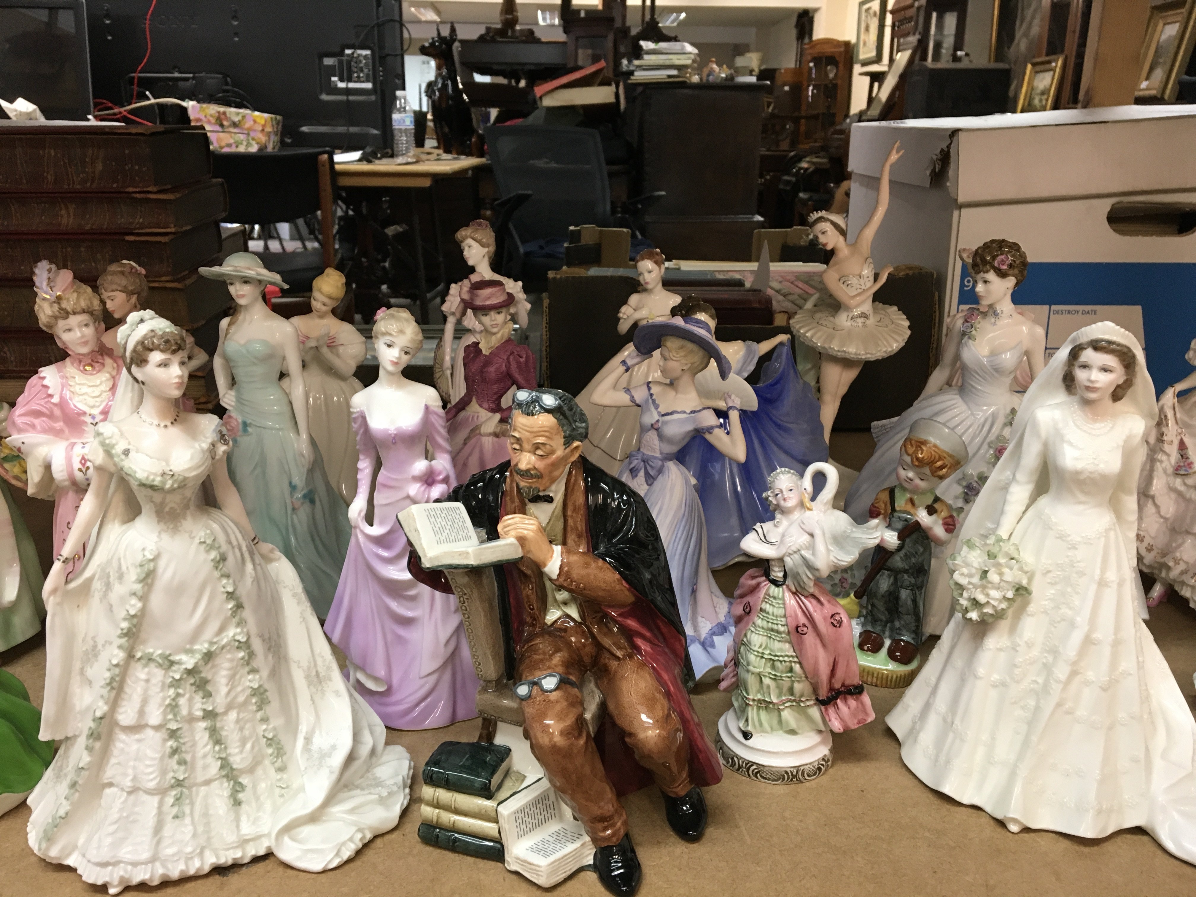 A collection of porcelain figurines including Coal