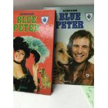 A collection of blue peter albums.