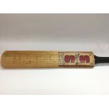 A signed cricket bat bearing the autographs of Ess