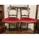 A set of six Victorian walnut dining chairs with u