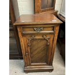 A Victorian gothic style walnut pot cupboard.