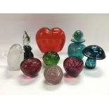 A collection of glass paperweights including Wedgw