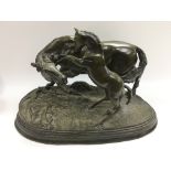 A bronze figural group of a horse and foal, approx