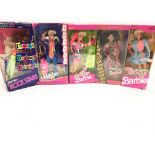 A Collection of 5 Boxed Barbies including Rock Sta