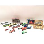 Collection of various vehicles including corgi and