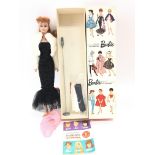 A Boxed Vintage Barbie from 1962 under the spotlig