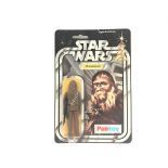 A Vintage Star Wars Palitoy 1977 Carded Chewbacca.