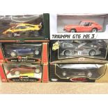 A Collection of 6 X 1:18 scale Boxed Die-cast Vehicles including a Sun Star Triumph GT6 MK3. A