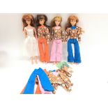 A Collection of 4 Action Girl Dolls and Clothing.