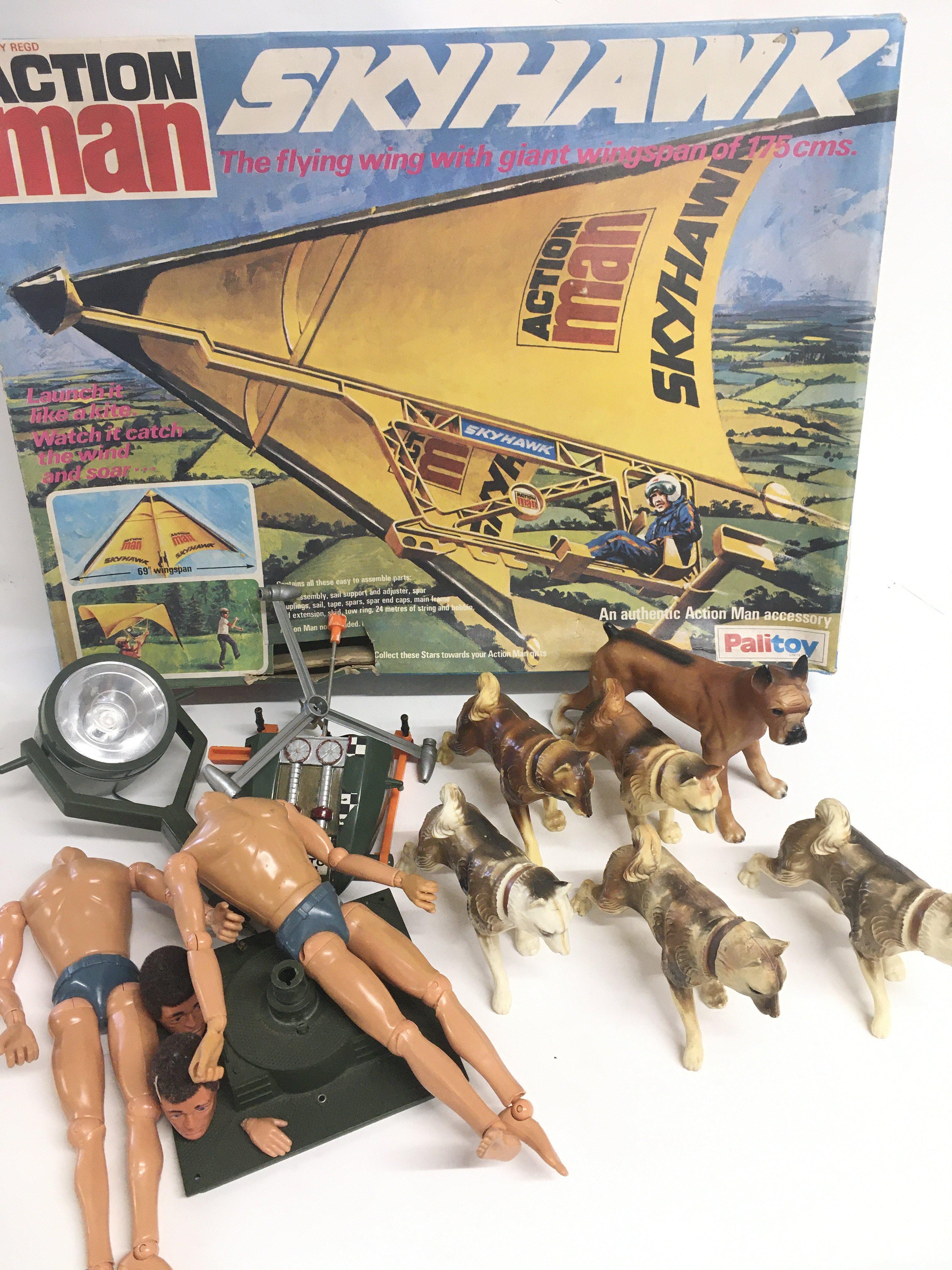 A Box Containing Action Men and accessories. A Box