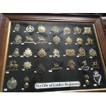 An oak cased display of military badges The City o