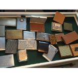 A collection of cigarette cases of various design