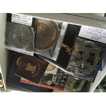 A box containing commemorative coins medallions an