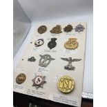 An album containing military badges and some helme