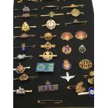 A collection of military regimental bar broaches a