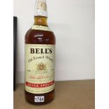 A 4,5 litre bottle of Bells scotch whisky.