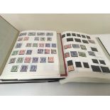 Three stamp albums containing Australian and Canad