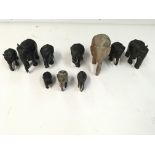 A Collection of various carved wooden elephants. N