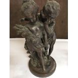 A Bronze Statue of cherubs. Approximate height 43CM.