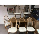 A modern design Ercol dinning table with a set of