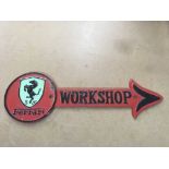 A cast iron Ferrari workshop sign .